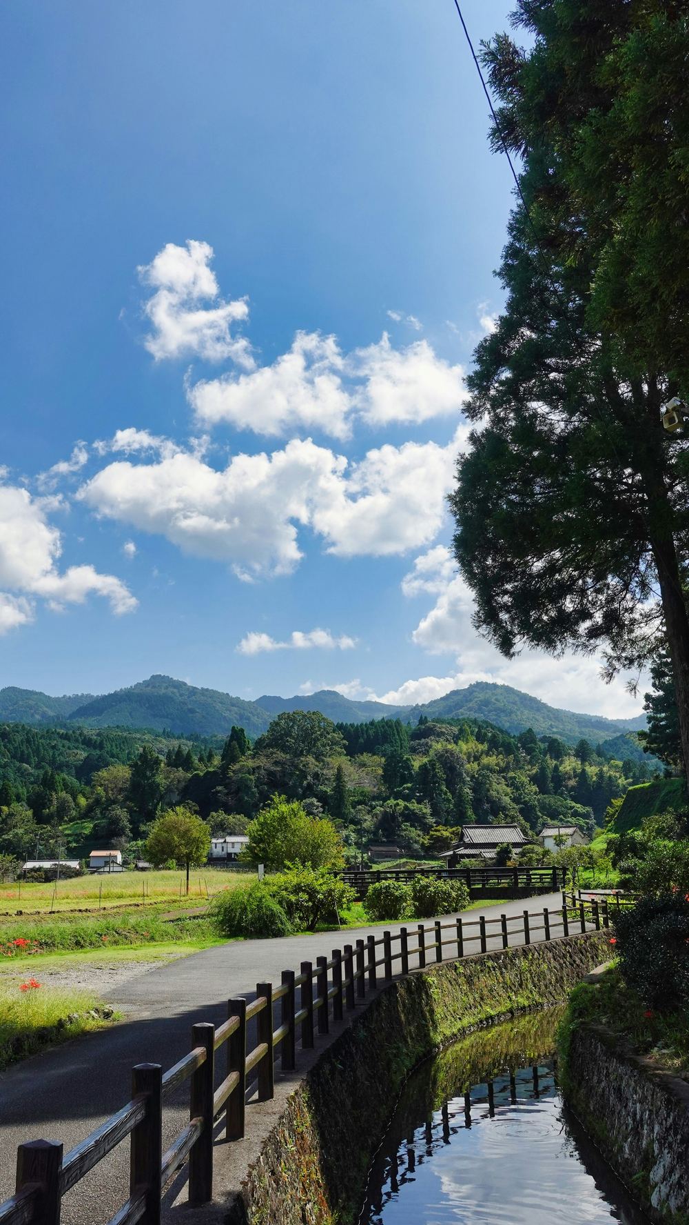 Countryside road leading toward the mountains