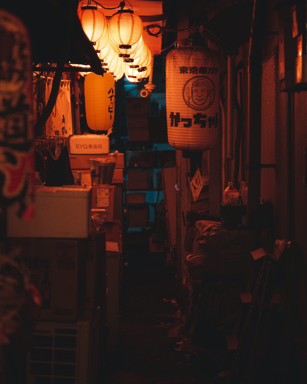 A lantern-lit izakaya alley at night